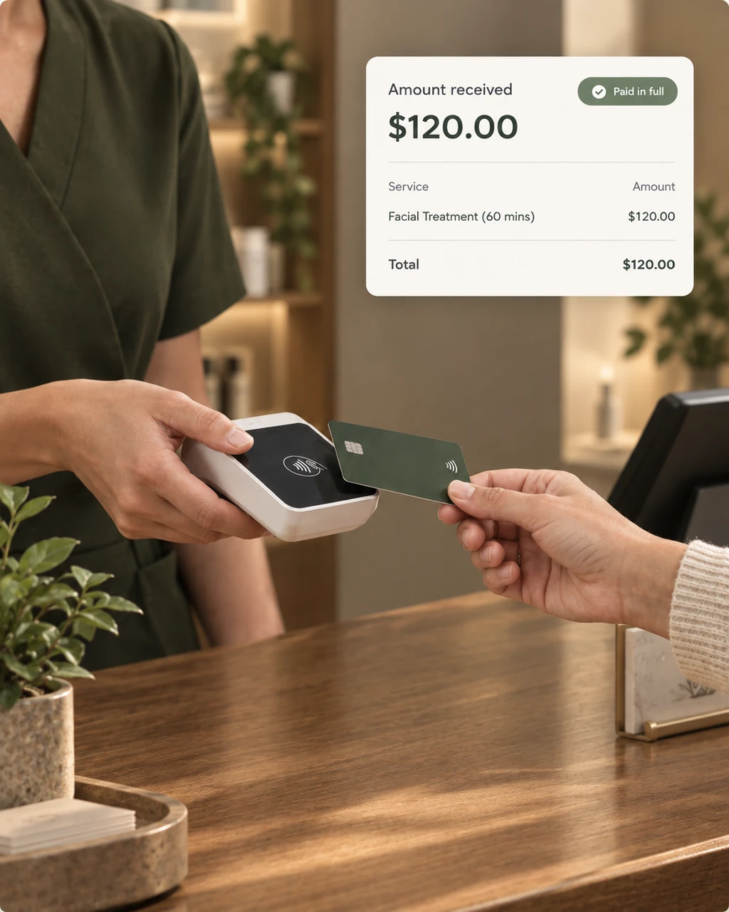 Contactless card payment at a salon counter with an Amount received $120.00 confirmation card
