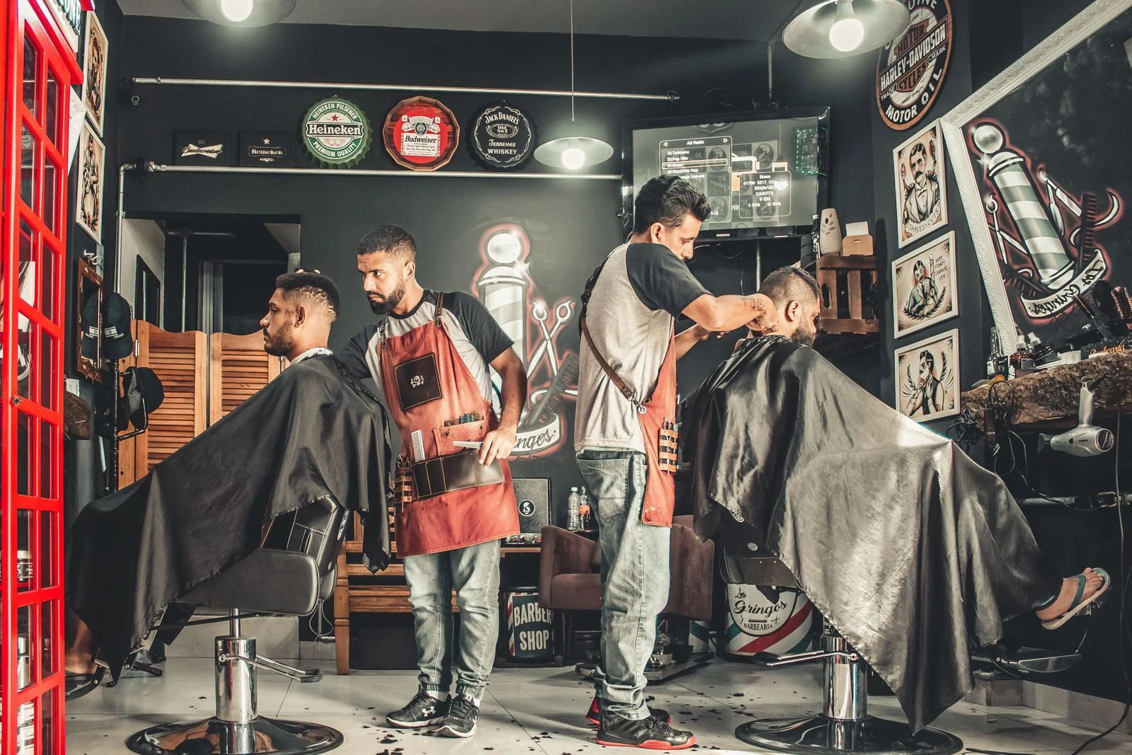 Barbers cutting hair in a barbershop